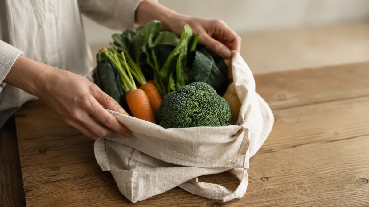 Cloth produce bag of vegetables in soft light