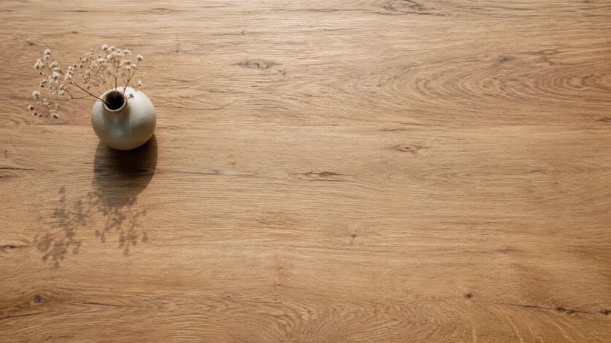 Empty wooden table with a single vase in soft light
