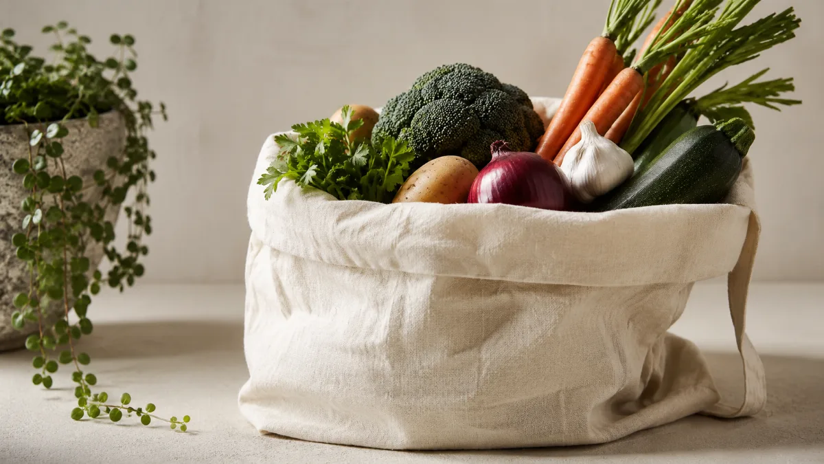 Cloth produce bag of vegetables in soft light